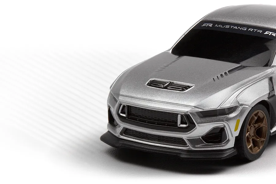 Close-up studio shot of the front-left corner of a silver HPI Nano-TTR Ford Mustang Spec 5 RC car body.