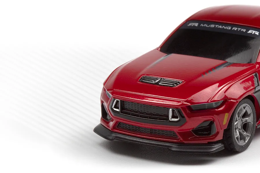 Close-up studio view of the front and side of the red HPI Nano-TTR Ford Mustang Spec 5 RC car body.