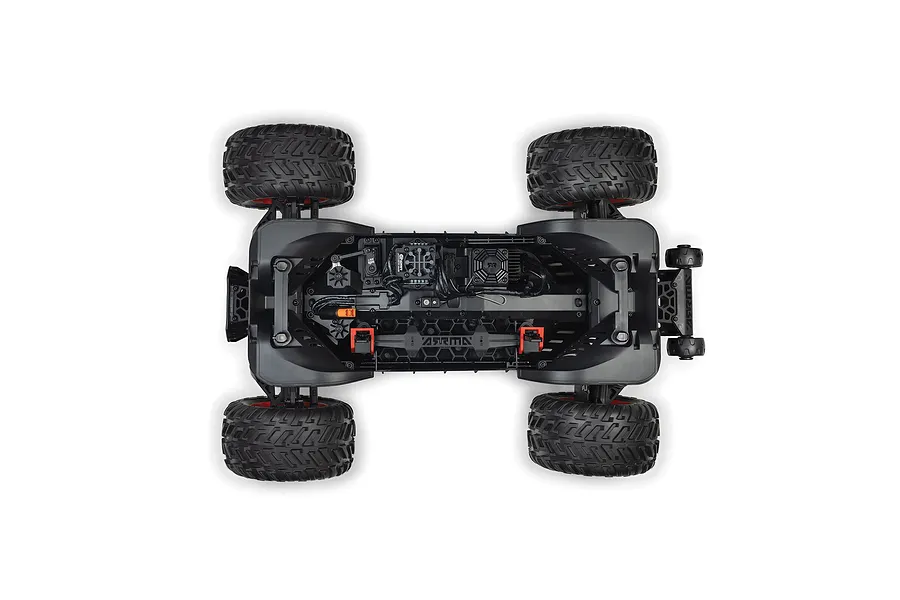 Top-down studio view of the chassis layout and internal electronics of the ARRMA Quake 4S RC monster truck.