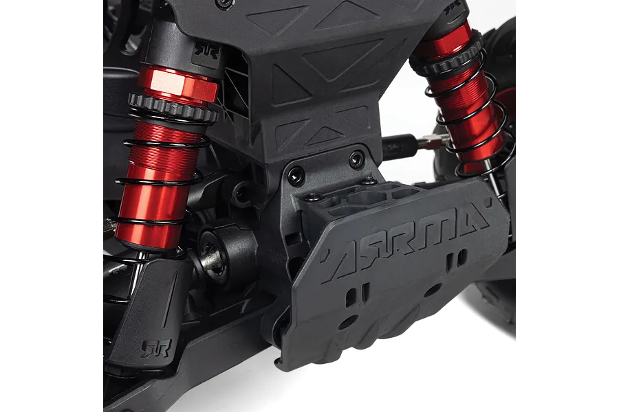Close-up view of the rear suspension and skid plate on an ARRMA 1/8 scale RC monster truck featuring red anodized shocks.