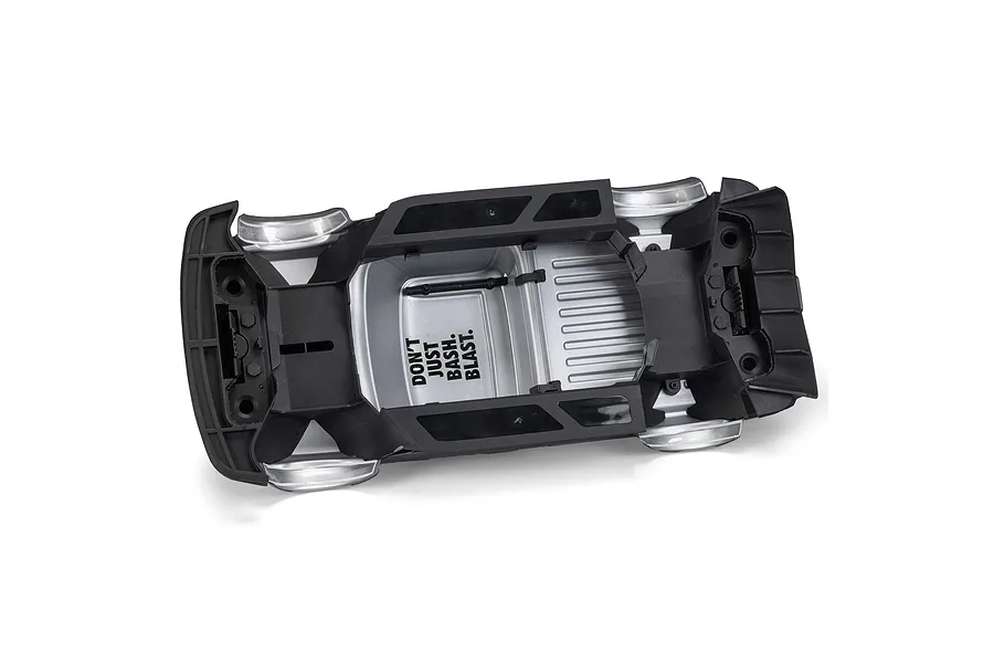 Underside view of the ARRMA Infraction 3S RC car body shell in white, showing plastic chassis armor and text.