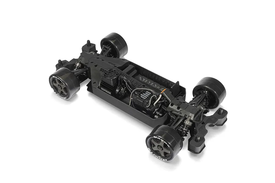 Top-down studio shot of the ARRMA Infraction chassis without body shell, showing electronics, wheels, and suspension on a white background.