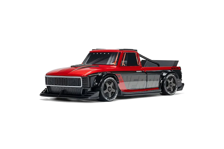 Studio shot of ARRMA Infraction Grom 3S red and black electric RC street truck on a white background.
