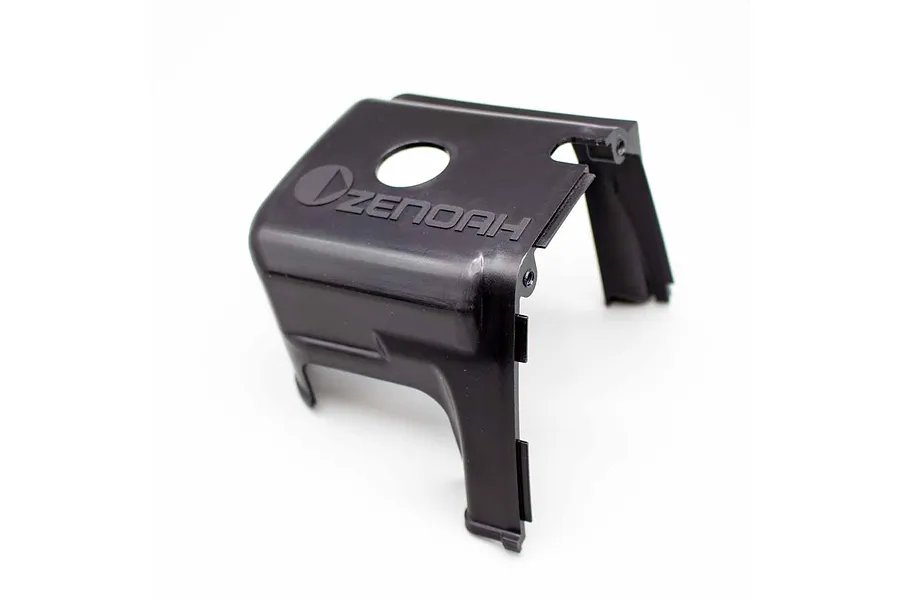 Zenoah black plastic engine cover assembly with embossed Zenoah logo against a white background.
