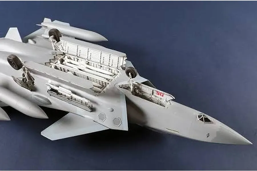 Underside view of the Trumpeter 1/48 scale Chinese J-20S Mighty Dragon plastic model jet kit, showing landing gear and weapons bay.