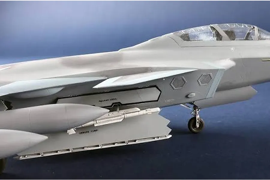 Close-up of a 1/48 scale model kit of the Chinese J-20S jet showing the cockpit and weapon bay.