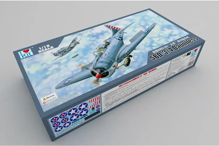 I Love Kit 1/18 scale SBD-3/4 Dauntless bomber plastic model kit box packaging showing aircraft artwork against a cloudy sky.
