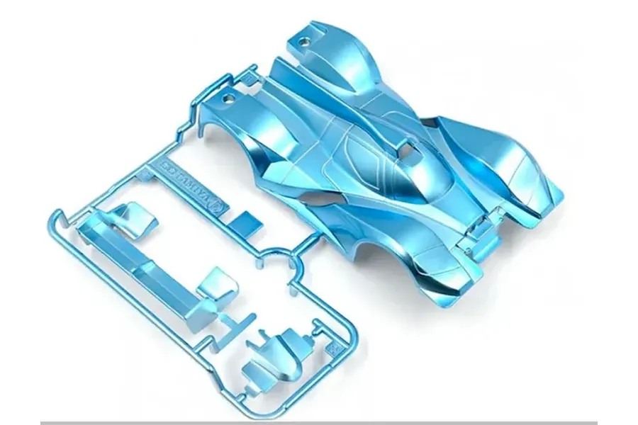 Tamiya Heat Edge painted metallic blue body shell and accessories on a plastic parts tree against a white background.