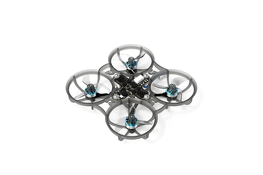 Studio shot of the BetaFPV Meteor65 Pro FPV drone showing its translucent grey frame, flight controller, and blue motors with clear propellers.