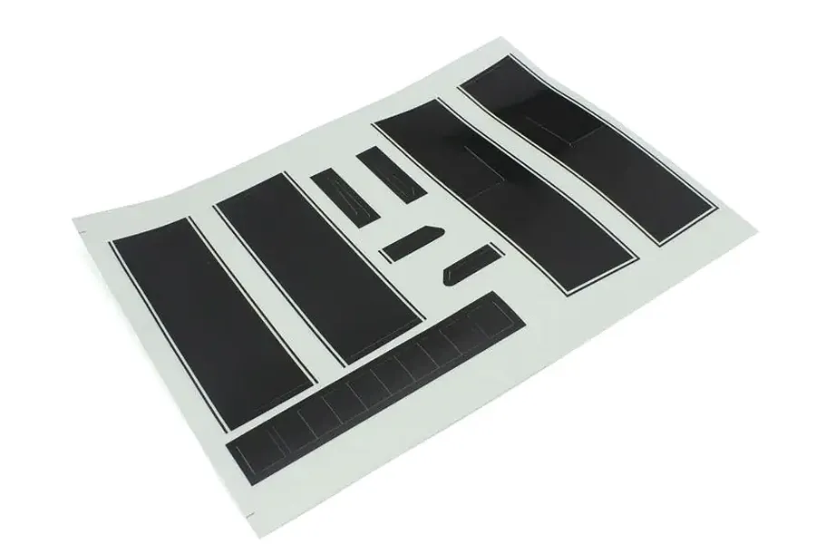 Kyosho 1/10 Outlaw Rampage Pro stripe decal sheet featuring black stripes and panels on a white backing paper.