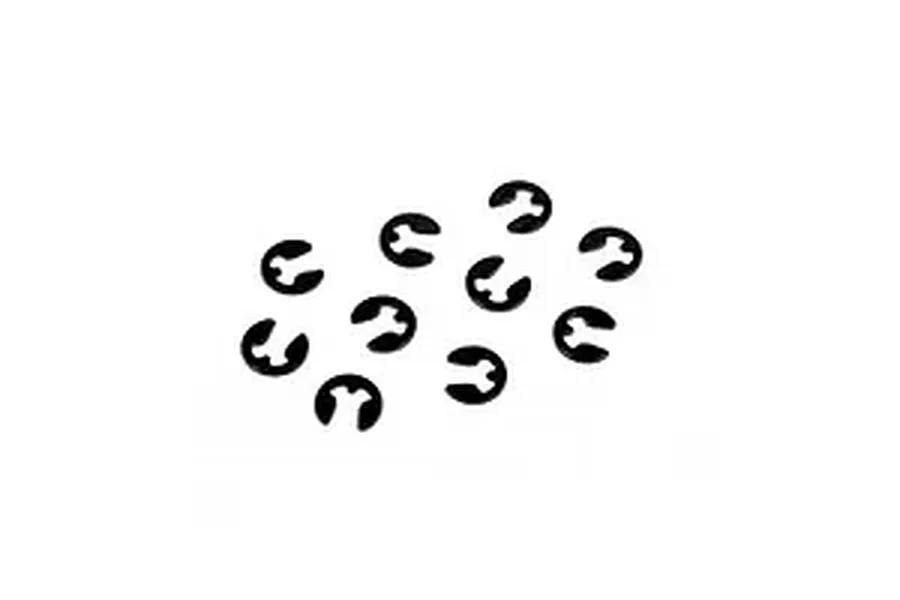 Ten small black metal E-clips scattered against a plain white studio background.