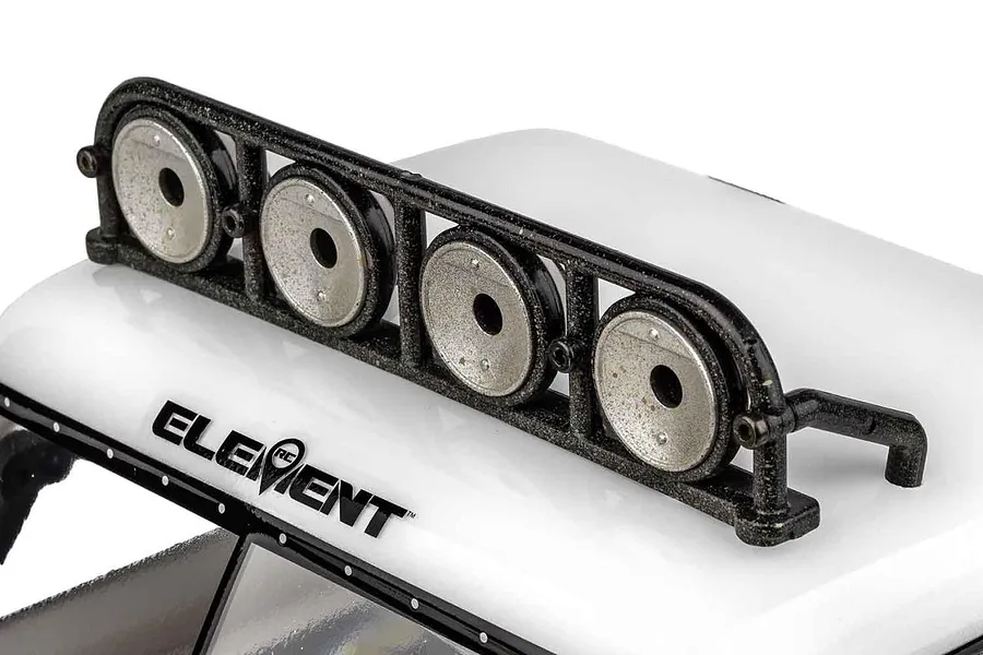 Close-up of the black plastic roof light bar mounted on the white cab of the Element RC Gaterunner trophy truck with Element logo visible.