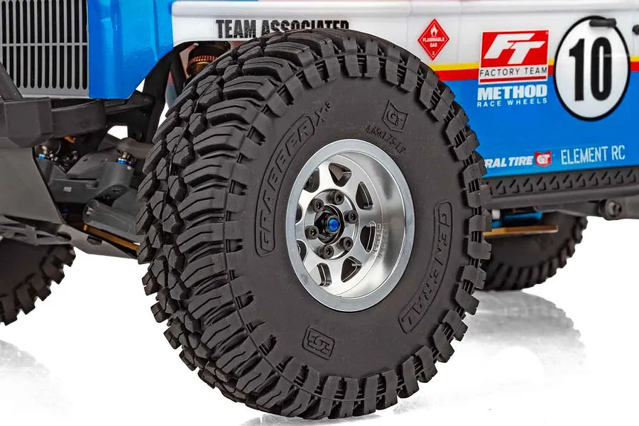Close-up of front wheel and tyre with aggressive tread pattern on the Element RC Gaterunner RC trophy truck.