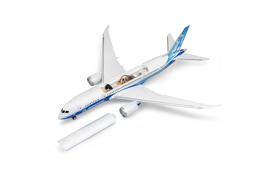 E-Flite Micro Boeing 787 Dreamliner RC airplane with its upper fuselage hatch removed to show internal electronics against a white background.