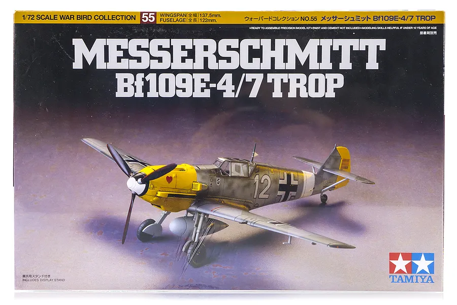 Tamiya 1/72 scale Messerschmitt Bf109 E-4/7 Trop model kit box art showing a finished aircraft model with yellow nose and desert camouflage.