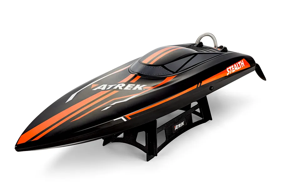 Atrek Stealth 25 inch deep V RC speed boat in black and orange on a black plastic display stand against a white background.