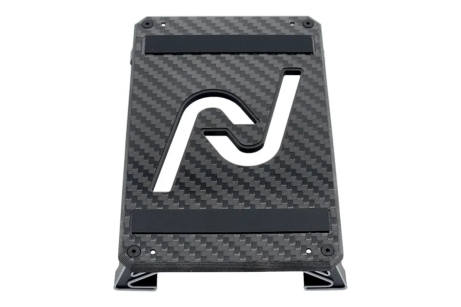 INOV8 3DX carbon fibre car stand featuring a black carbon weave top plate with cutouts and foam pads on a plain white background.