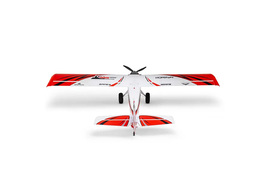 Rear-above studio shot of the E-Flite Turbo Timber Evolution RC plane, showing its white, red, and black trim scheme, high wing, and landing gear against a white background.