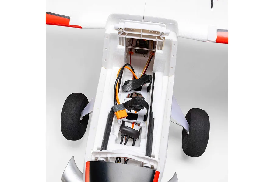 Top-down view of the interior battery compartment and electronics of the E-Flite Turbo Timber Evolution 1.5m RC plane.