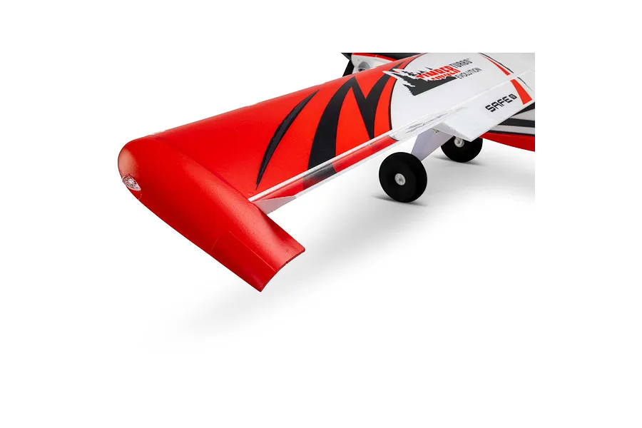 Close-up of the red and white foam wingtip, leading edge slats, and landing gear of an E-Flite Turbo Timber Evolution RC plane.