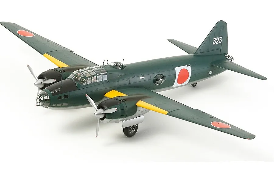 A completed 1/48 scale plastic model kit of a Mitsubishi G4M1 Model 11 bomber, painted in dark green with Japanese insignia.
