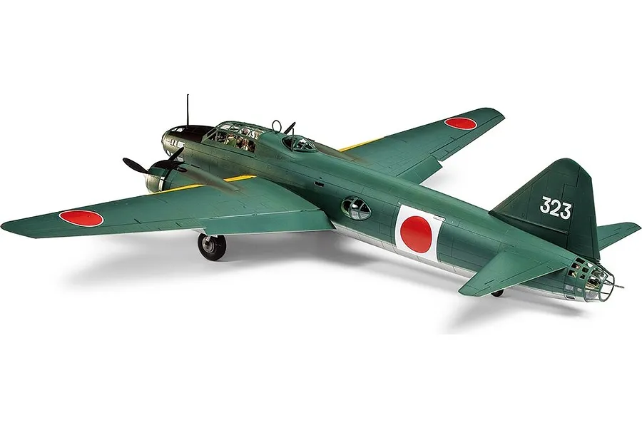 A completed Tamiya 1/48 scale plastic model kit of a Mitsubishi G4M1 Model 11 bomber, painted in green and silver with Japanese insignia.