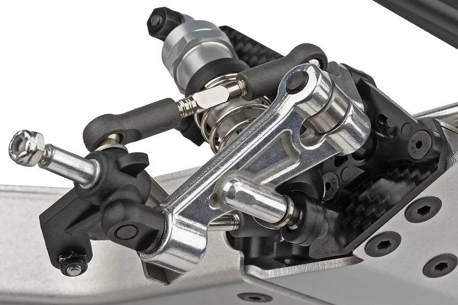 Studio product shot of the front suspension and steering assembly on a 1/10 scale RC buggy kit against a white background.