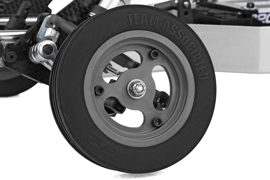 Close-up of the front wheel and suspension on the Team Associated RC10 Ultra Rider 1/10 scale RC buggy.