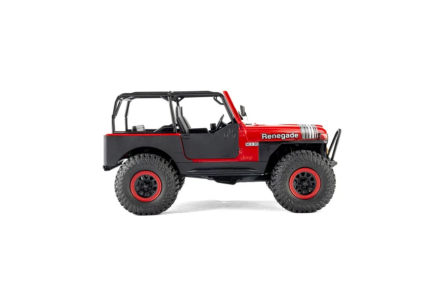Studio side profile shot of the Axial SCX30 Jeep CJ-7 Renegade red RC rock crawler showing its detailed body, roll cage, and large tires.
