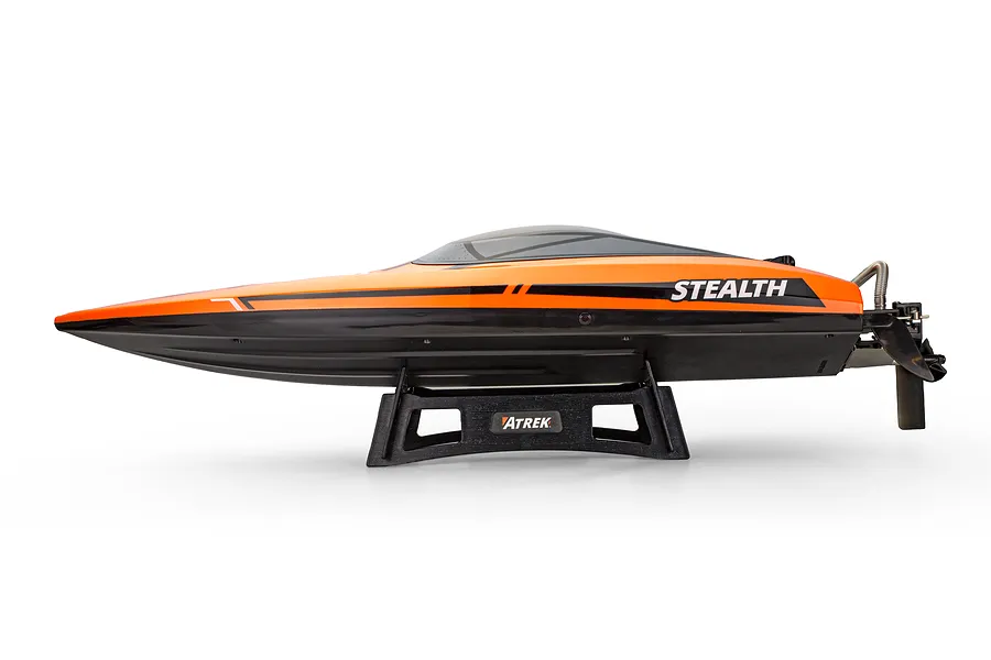 Side view of the Atrek Stealth 25 inch orange and black brushless RC speed boat resting on a black stand.