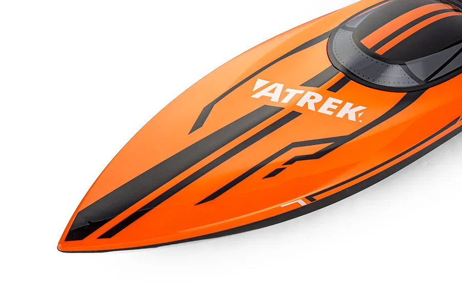 Close-up studio view of the orange and black bow section of the Atrek Stealth RC boat hull, featuring the ATREK logo.