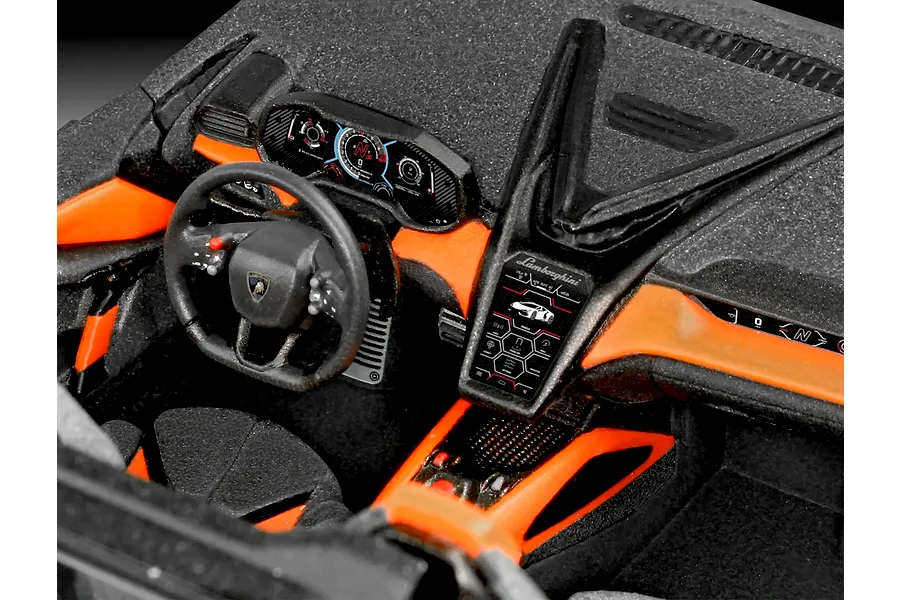 Detailed interior view of a built Revell 1/24 scale Lamborghini Revuelto model car, showing the dashboard, steering wheel, and center console.
