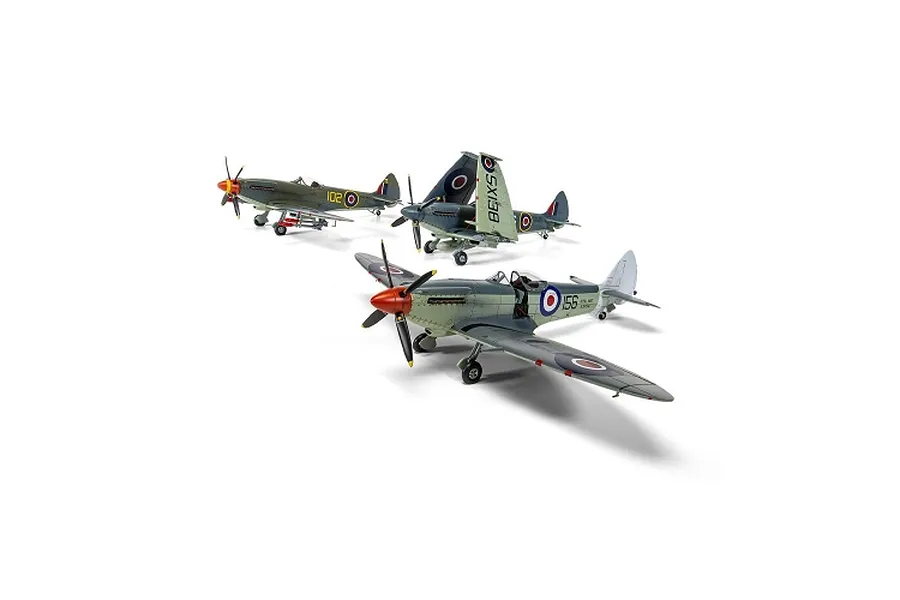 Three assembled and painted plastic model fighter aircraft shown against a white background.