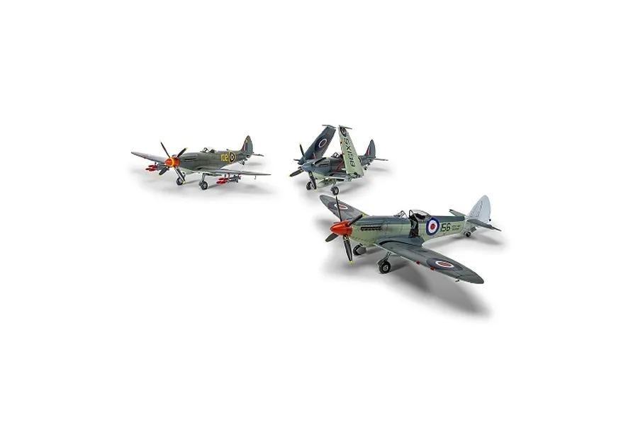 Three assembled and painted plastic model fighter aircraft shown against a plain white studio background.