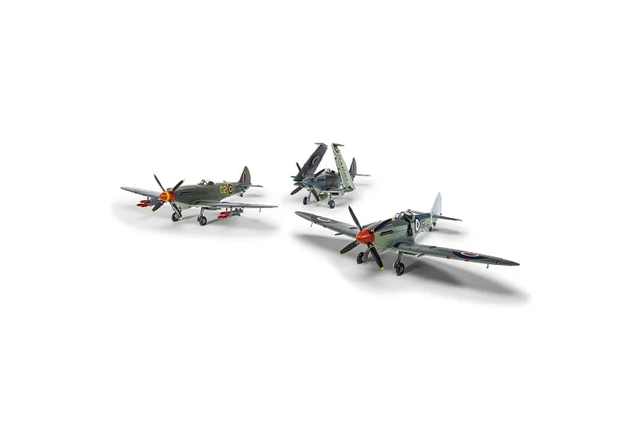 Three assembled and painted plastic model fighter aircraft shown against a plain white background.