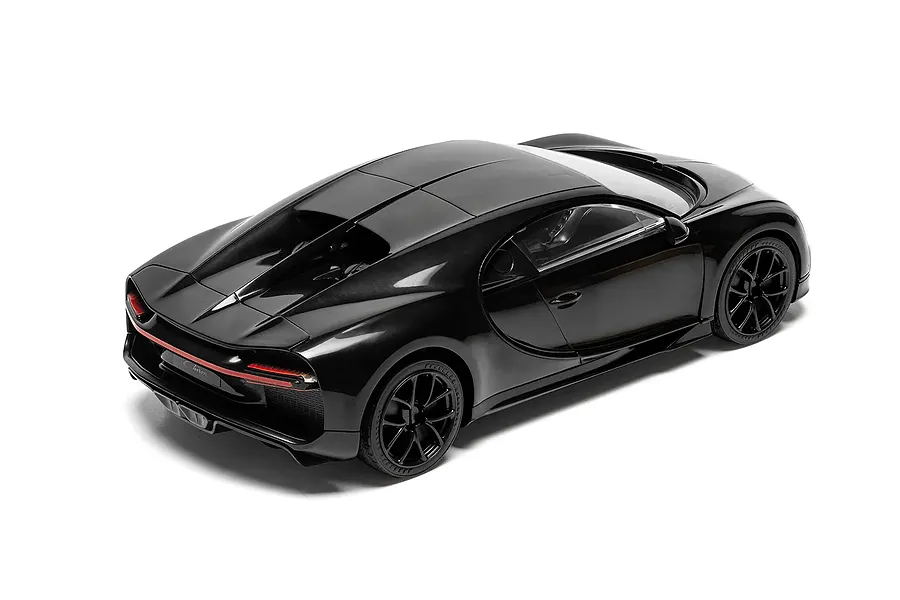 Rear three-quarter studio view of the assembled black Bugatti Chiron plastic model car set against a clean white background.