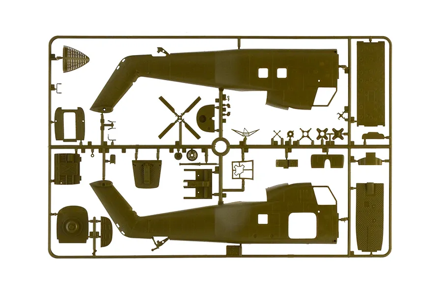 Olive green plastic model kit sprue containing helicopter fuselage halves, rotor blades, and interior components.
