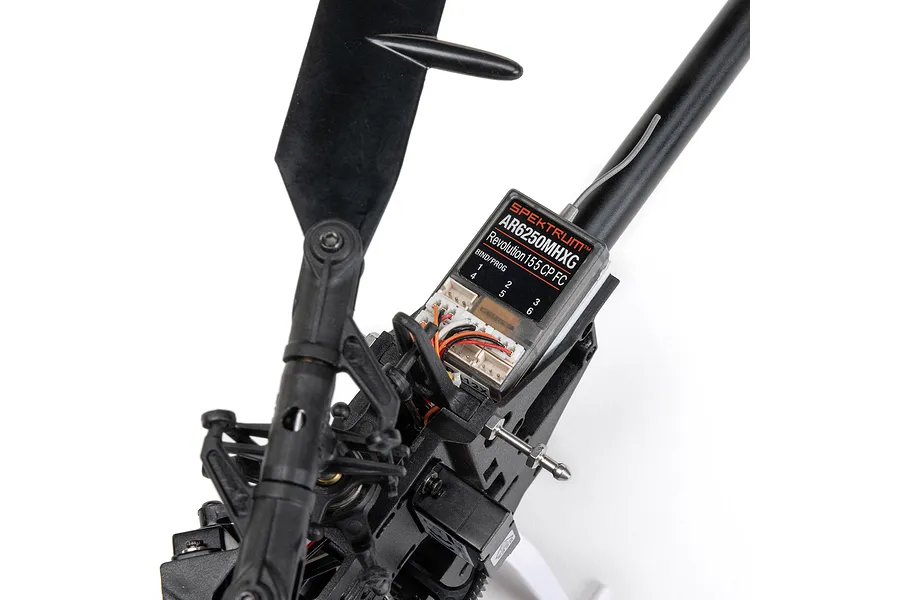 Close-up of the Spektrum AR6250MHXG Revolution 155 CP FC flight controller installed on the Blade RC helicopter frame.