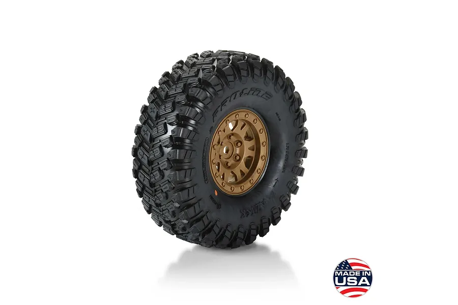 Pro-Line 1.9 inch crawler tyre mounted on a bronze Impulse rim with aggressive tread pattern against a white background.