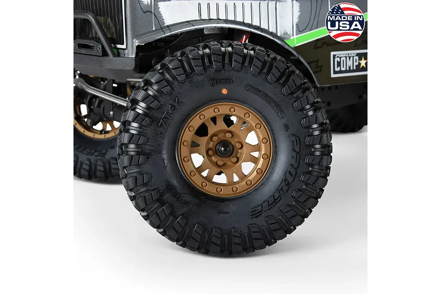 Pro-Line 1.9" Aztek G8 crawler tyre mounted on a bronze Impulse rim fitted to an RC vehicle.