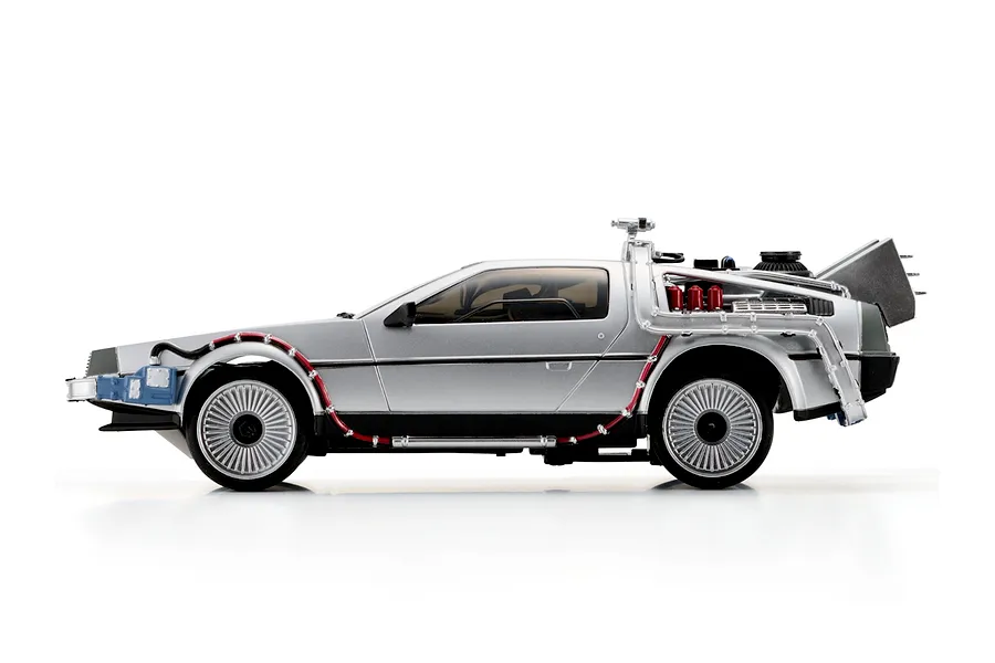 Side profile studio shot of the Kyosho First Mini-Z Back to the Future DeLorean RC car on a white background.