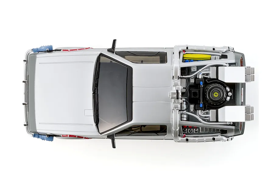 Top-down studio view of the Kyosho First Mini-Z Back to the Future DeLorean RC car showcasing its detailed rear time machine equipment.