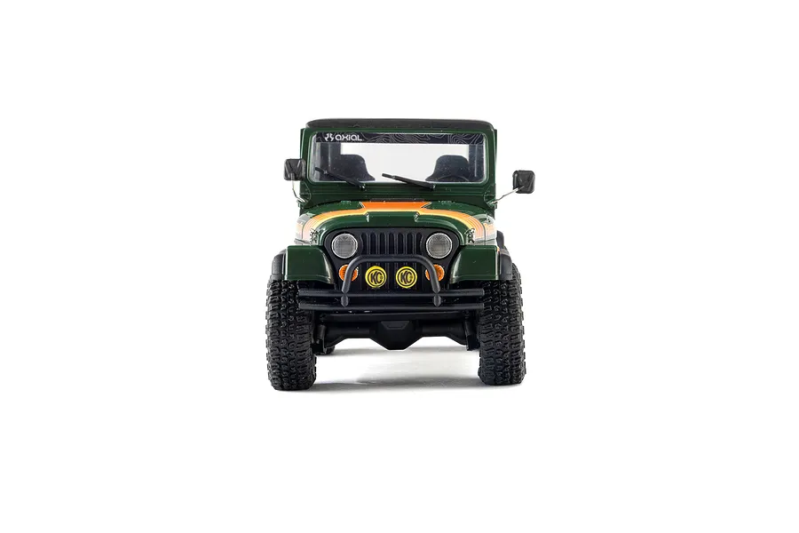 Front view of the green Axial SCX30 Jeep CJ-7 Renegade RC rock crawler showing its grille, bumper, and KC auxiliary lights.