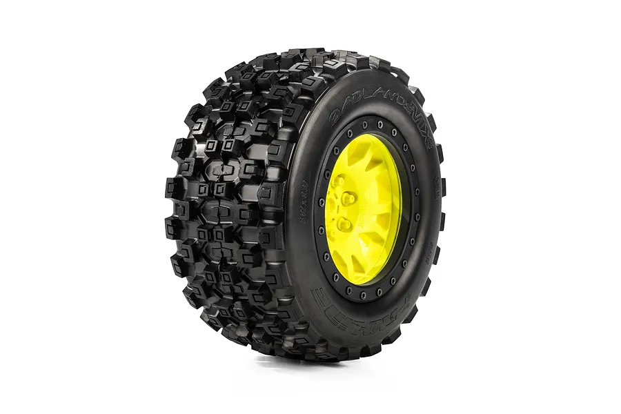 Pro-Line 1/5 Badlands MX43 Pro-Loc Tyre mounted on a yellow and black Impulse beadlock wheel against a white background.