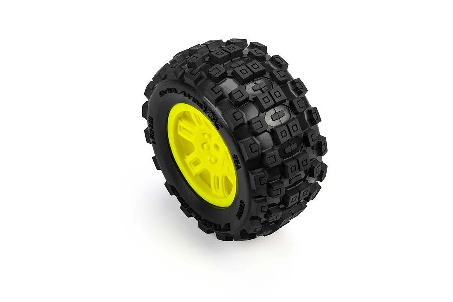 Single Pro-Line RC monster truck wheel with a black knobby tire and bright yellow split-six rim against a white background.