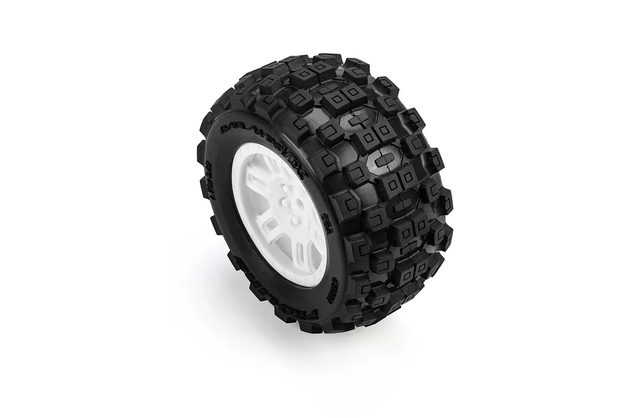 Pro-Line 1/16 Badlands MX MT tyre mounted on a white split-six plastic wheel rim against a plain white studio background.