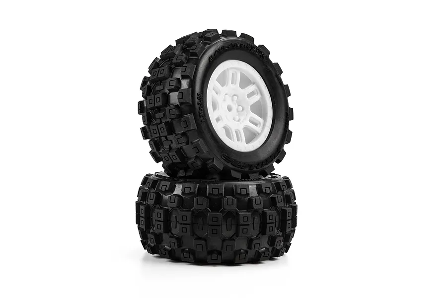 Pro-Line 1/16 Badlands MX MT Tyres on White Split Six Rims stacked against a clean white background.