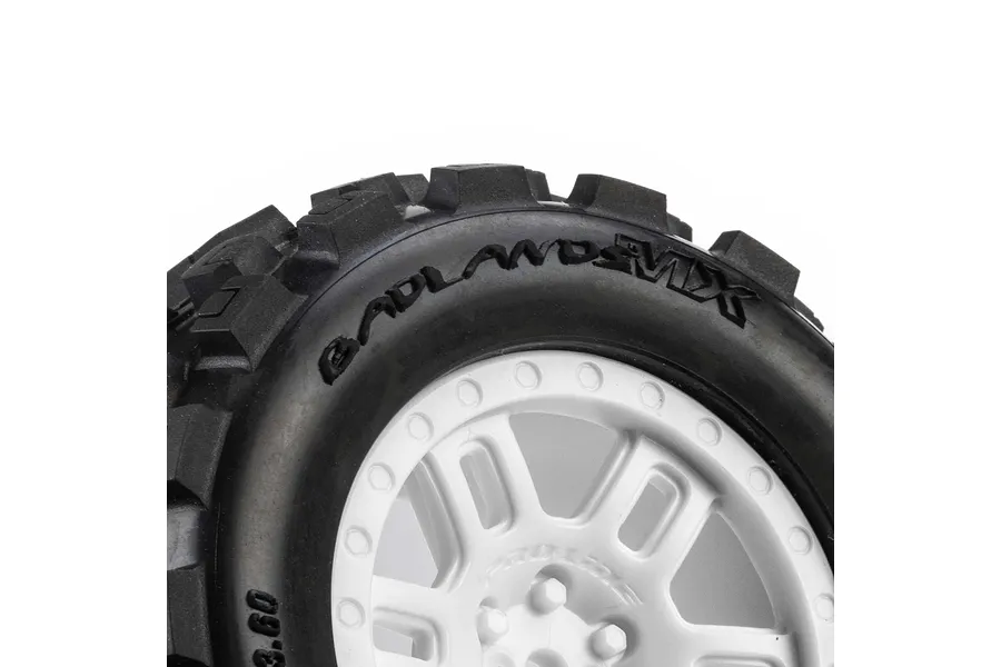 Close-up of Pro-Line Badlands MX tyre on a white split-six rim against a plain white background.