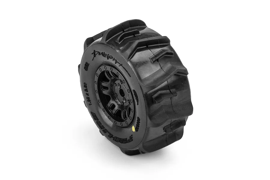 Single Pro-Line paddle tyre mounted on a black split-six rim against a white background.