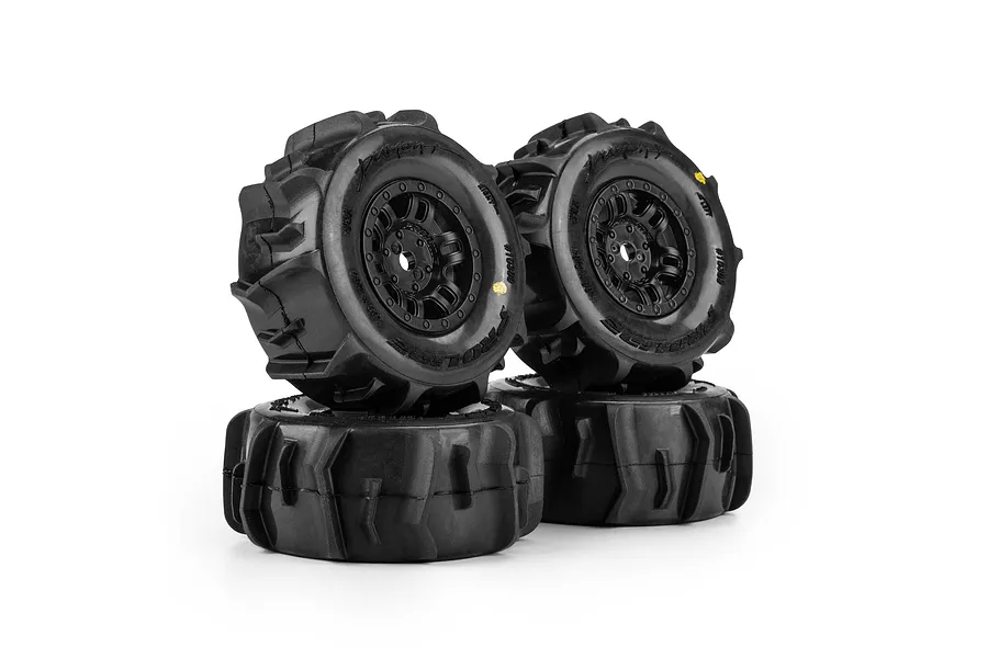 Four Pro-Line Dumont paddle tyres mounted on black split-six rims against a white background.